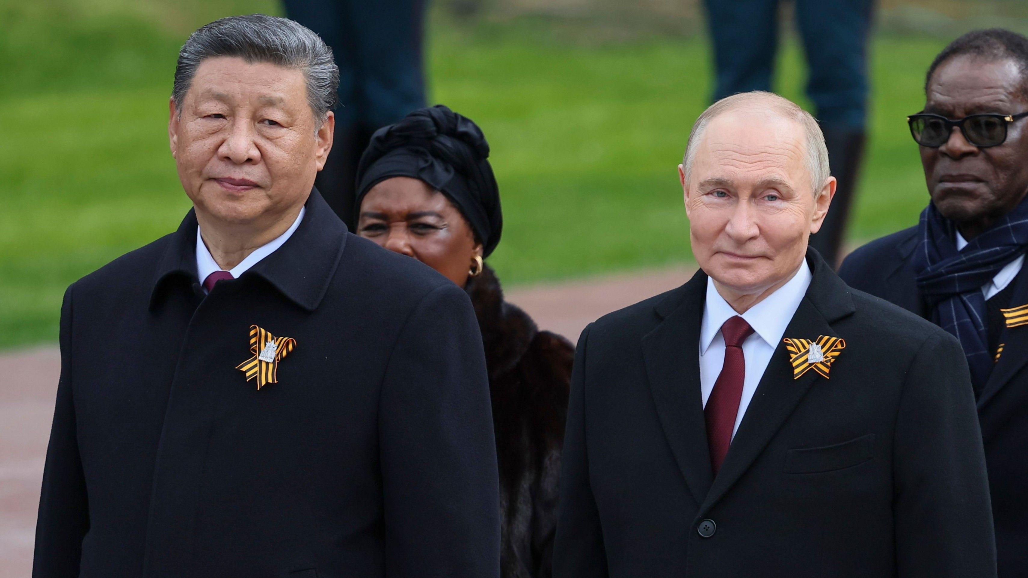 Chinas Xi stands with Putin at Russias Victory Day parade