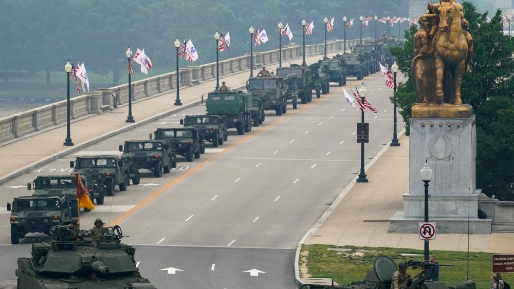 Trump hosts military parade as protesters rally across US against his presidency