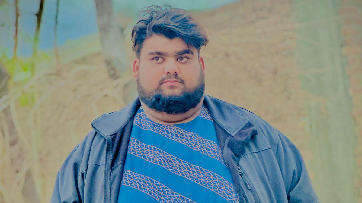 Qudratullah seen in a blue jacket
