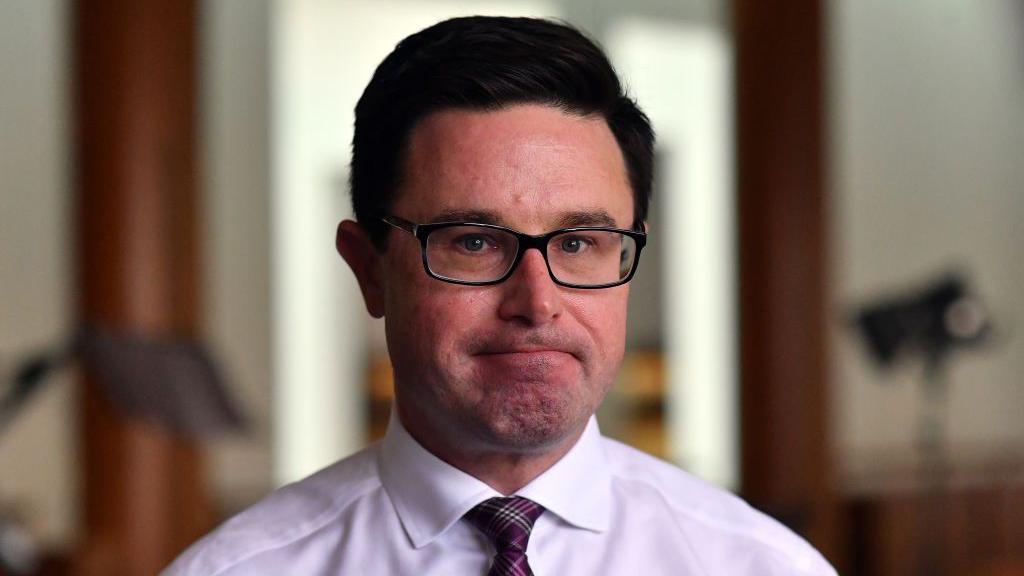 Australias Liberal-National coalition splits after election thrashing
