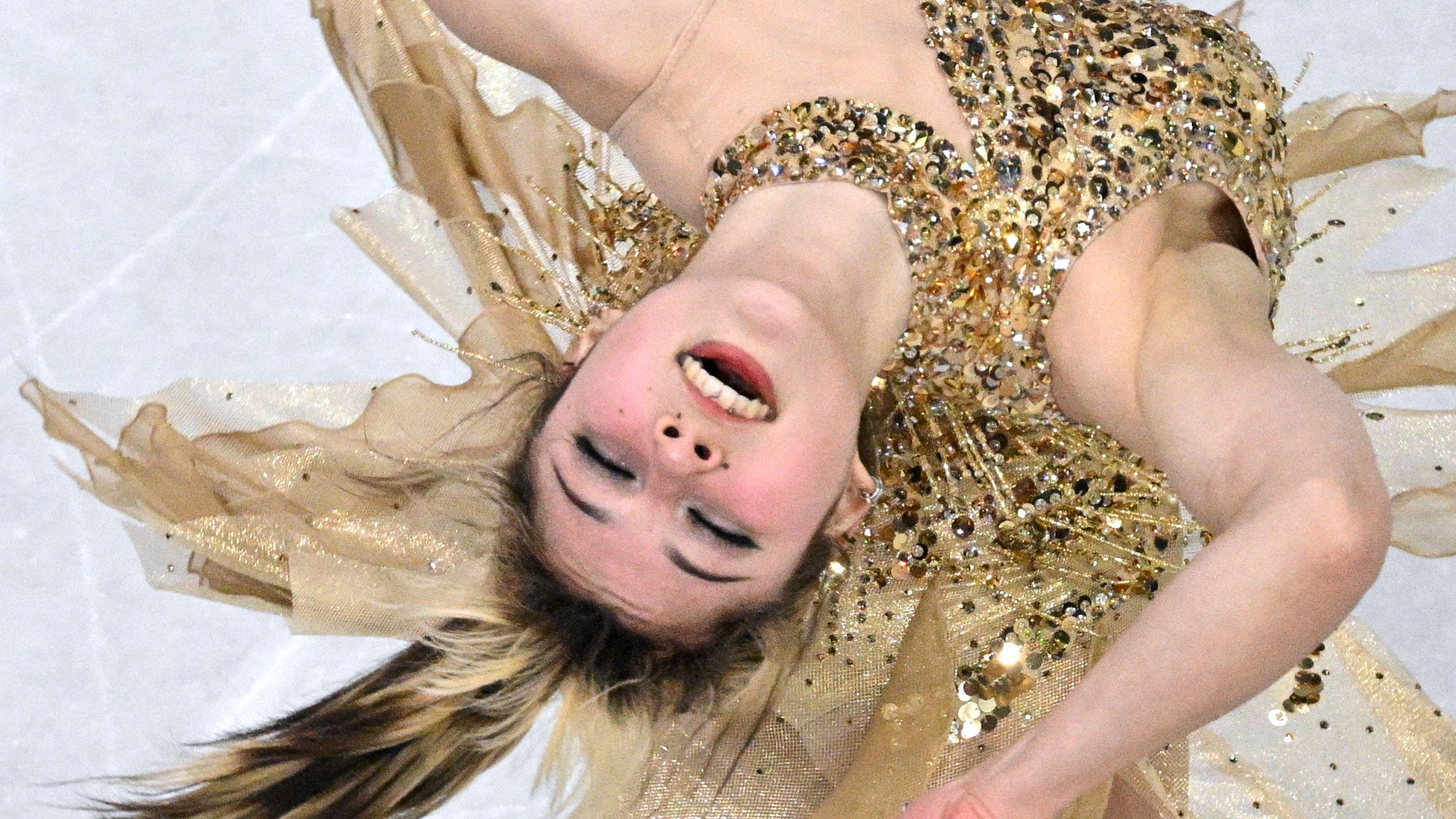 USA superstar Liu wins womens skating Olympic gold