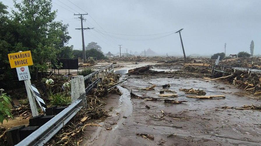 Rescuers try to reach people missing in landslides as rains wreak havoc in New Zealand