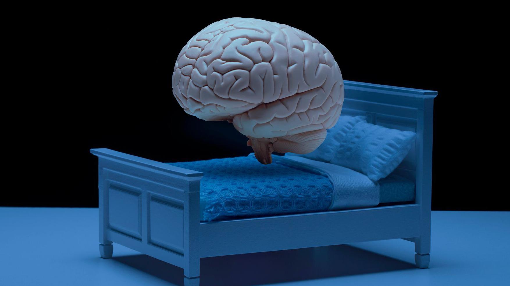 Um c&eacute;rebro flutua acima de uma cama em um quarto escuro, em uma imagem animada