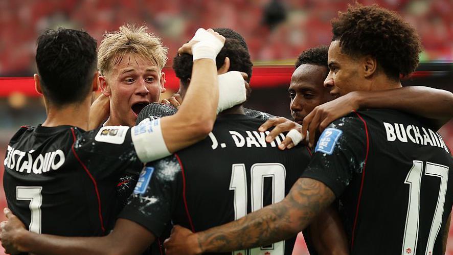 David doubles Canadas lead against 10-man Qatar as knockouts move closer