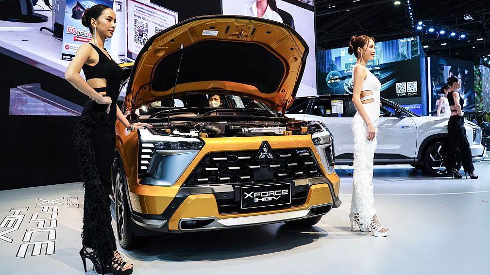 iPhone maker announces plan to build Mitsubishi EVs