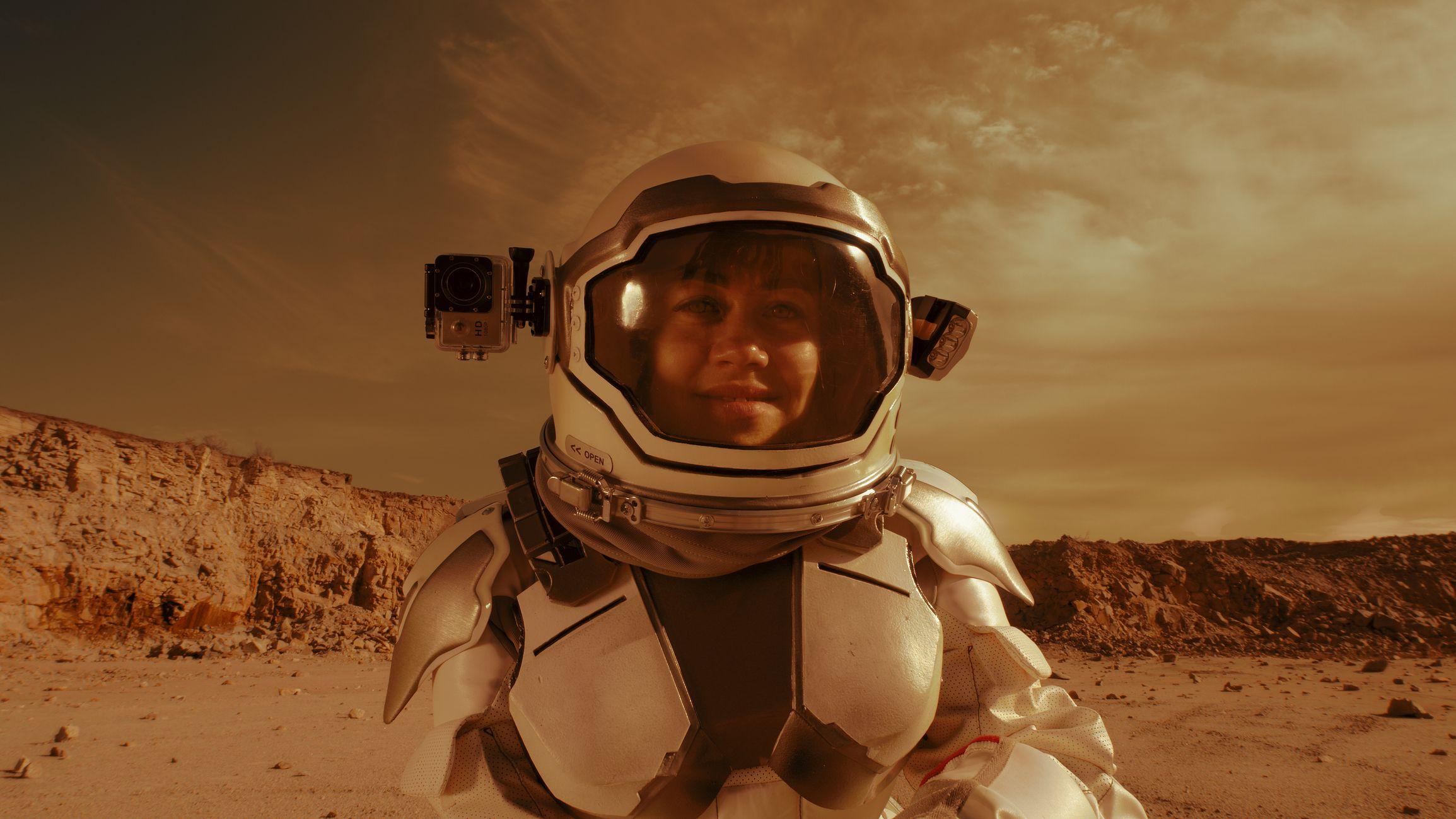 Imagen ilustrativa de una astronauta en la superficie del planeta Marte.