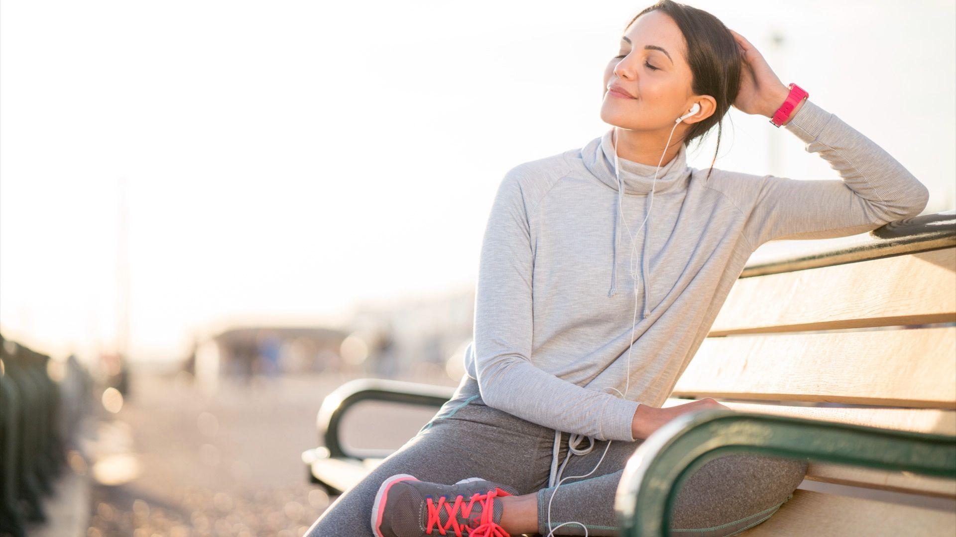 A woman resting while on a run