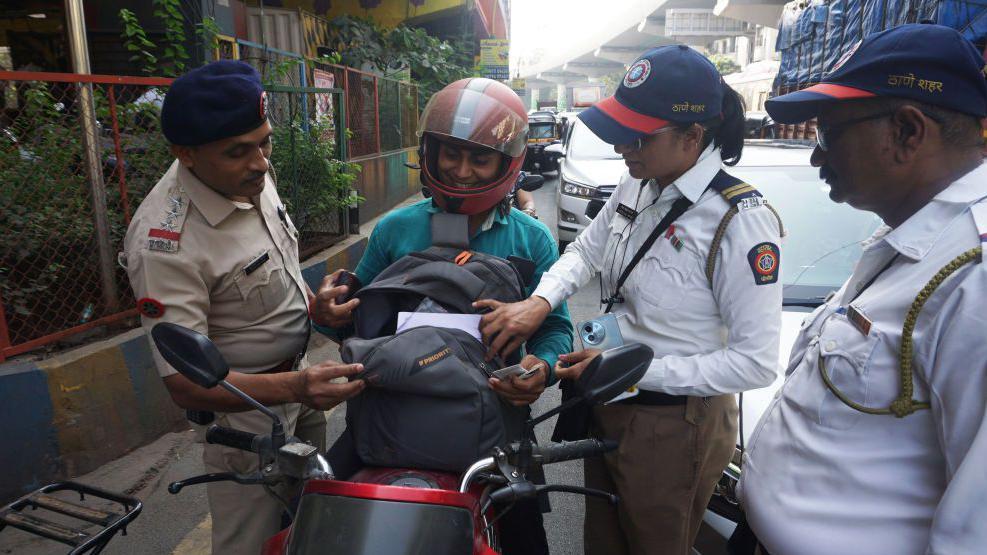  People ready to welcome the new year backdrop of new year. Mumbai Police are seen Checking vehicles entering Mumbai at Mumbai Entry Point Mulund Toll Naka , in Thane, on December 31, 2024 in Mumbai, India.
