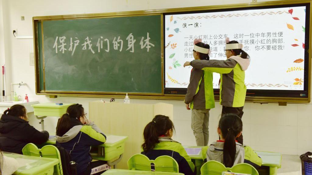A teacher teaches primary school students about identifying and preventing sexual assault in Hefei, Anhui Province, China, March 17, 2021