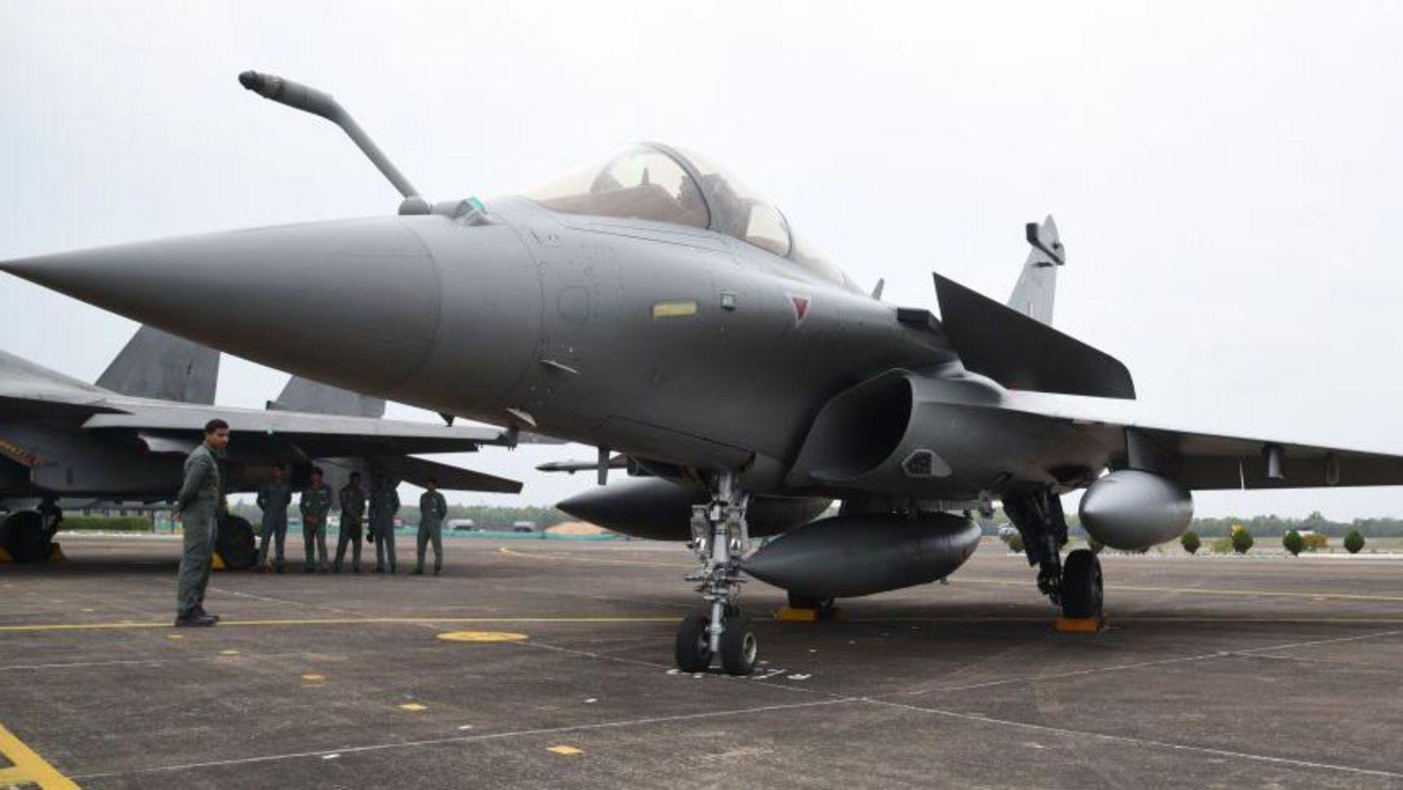 Indian Air Force personnel are standing next to a Rafale fighter jet during the joint 'Exercise Cope India 2023' at the air force station in Kalaikunda, around 170 km west of Kolkata, on April 24th, 2023.