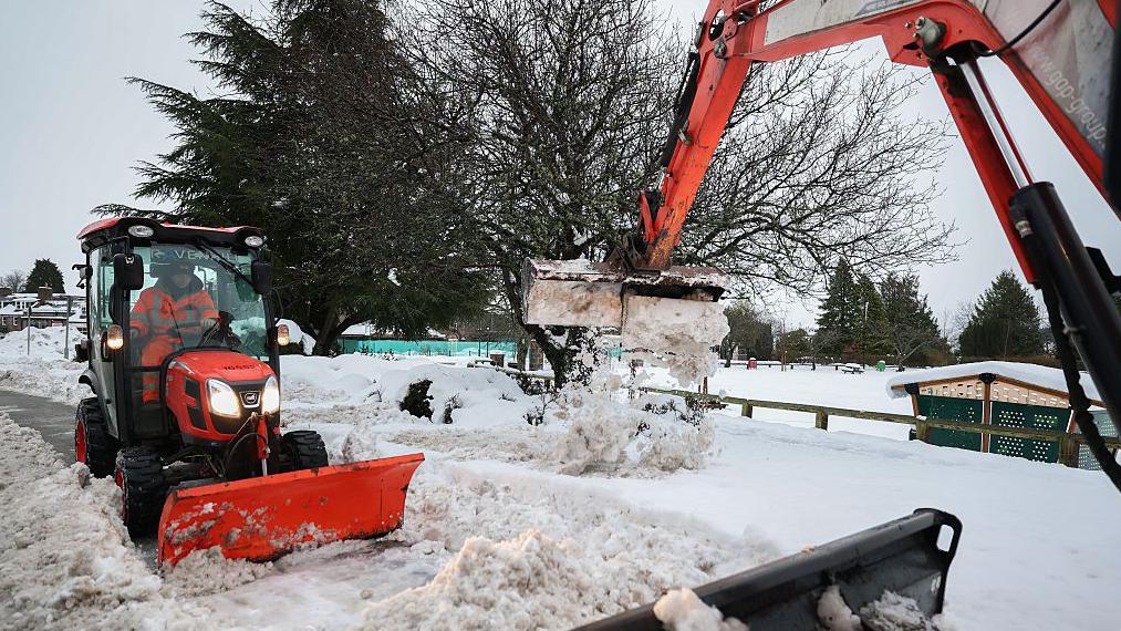 UK drivers warned to take care on icy roads as hundreds of flights cancelled in Europe