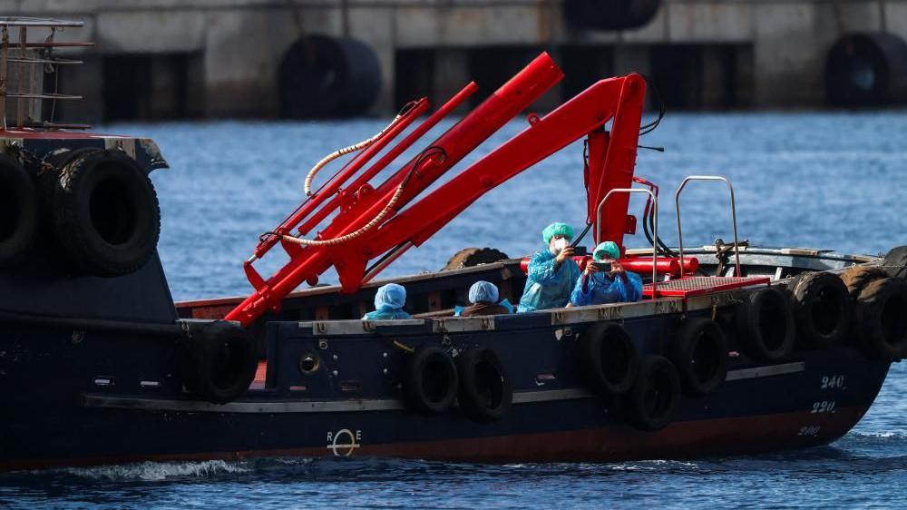 Spain starts evacuating virus-hit cruise ship in Tenerife