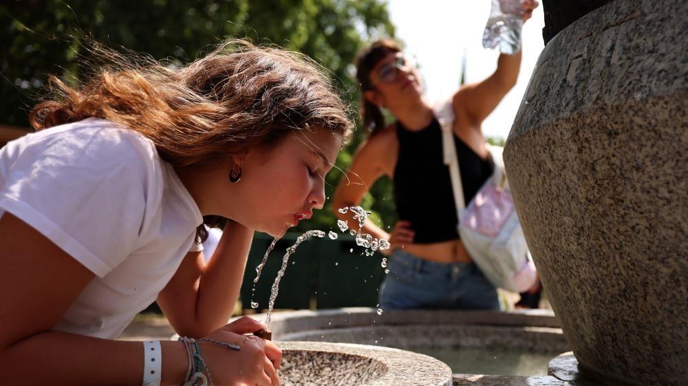 Temperatures near 36C as wildfires burn and areas on alert for flash floods after week of heat