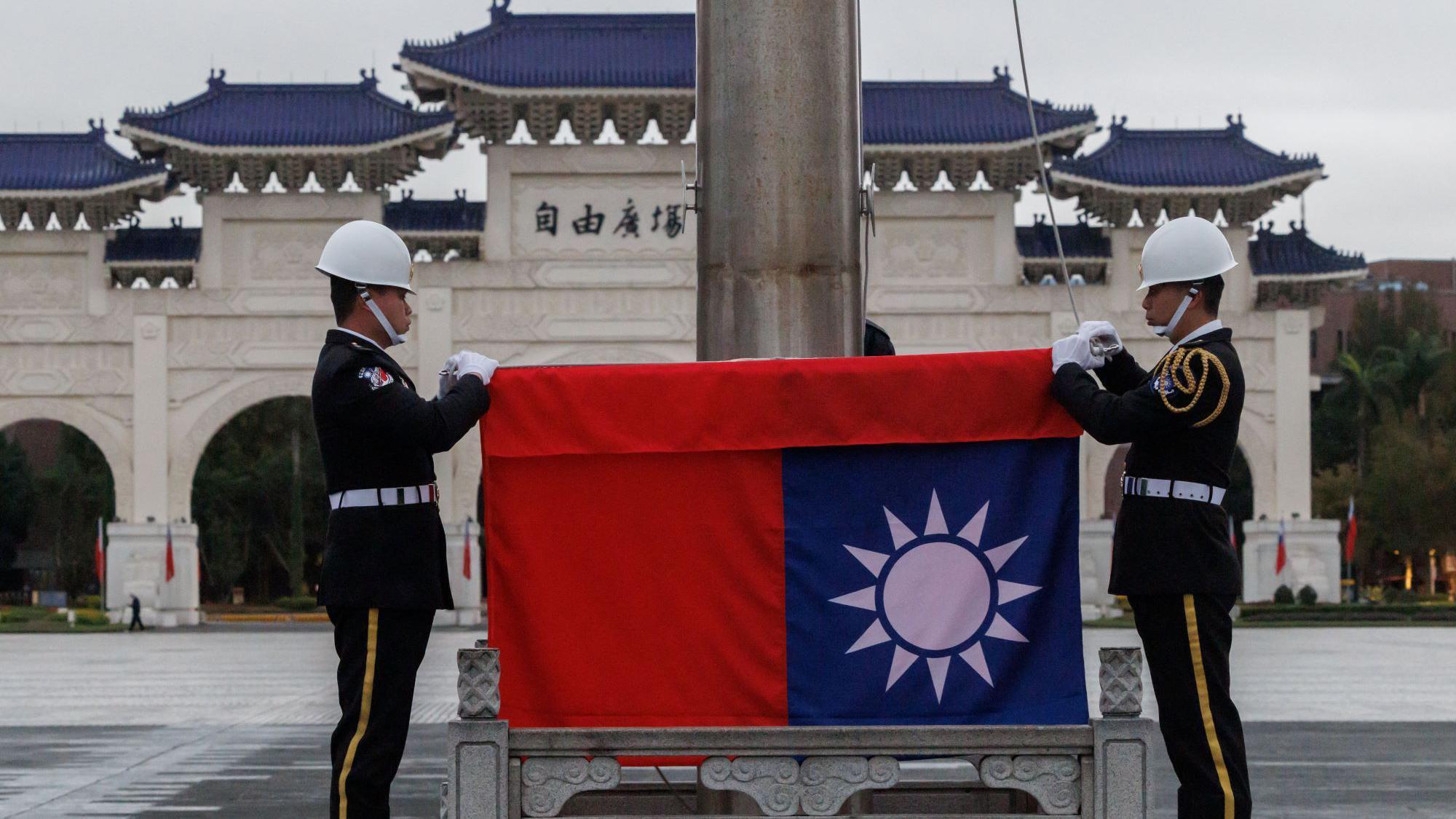 Taiwan's national flag is raised during an early morning flag-raising ceremony following China's People's Liberation Army said it would conduct live-fire drills in five designated maritime and airspace areas around Taiwan, in Taipei on December 30, 2025