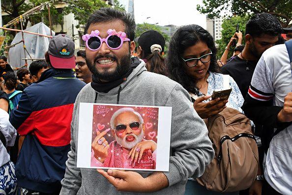 A demonstrator is seen holding a placard of Indian Prime Minister Narendra Modi during a protest in Mumbai. Youths supporting Cockroach Janata Party (CJP) held a protest against alleged paper leaks and irregularities in major national medical entrance examinations, seeking resignation of Union Education Minister Dharmendra Pradhan, demanding greater accountability and reforms in India's education system. 