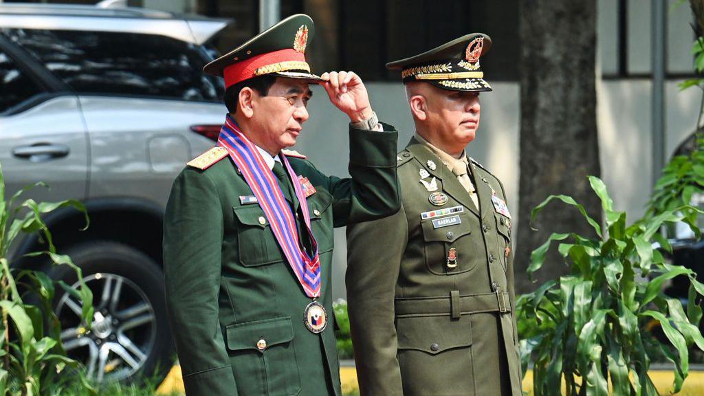 Deputy Chief of Staff of the Armed Forces of the Philippines Charlton Gaerlan (R) receives Vietnam's Minister of Defence General Phan Van Giang during a ceremonial welcome at the Department of National Defense office in Manila on August 30, 2024. 