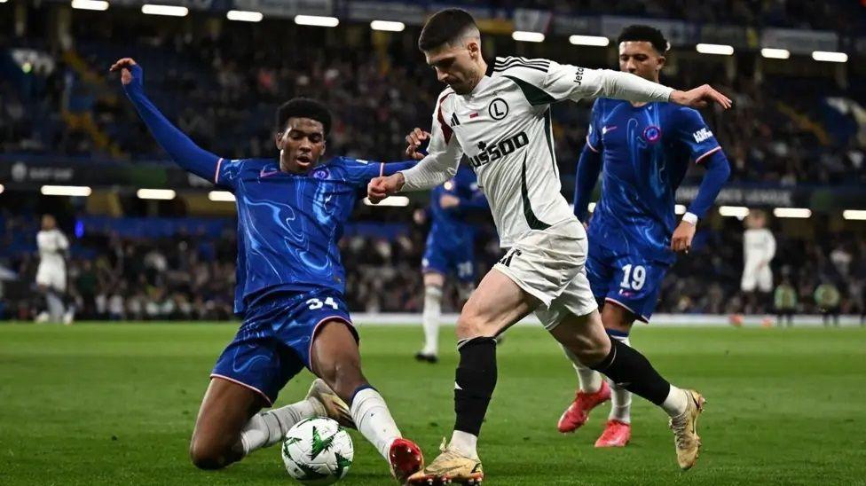 A picture of defender Josh Atchimbong tries to cut the ball