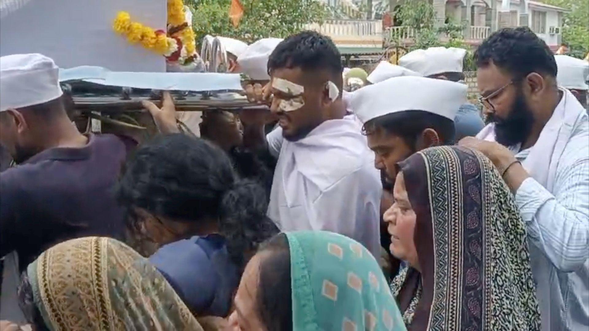 Lone Air India survivor carries coffin of brother killed in crash