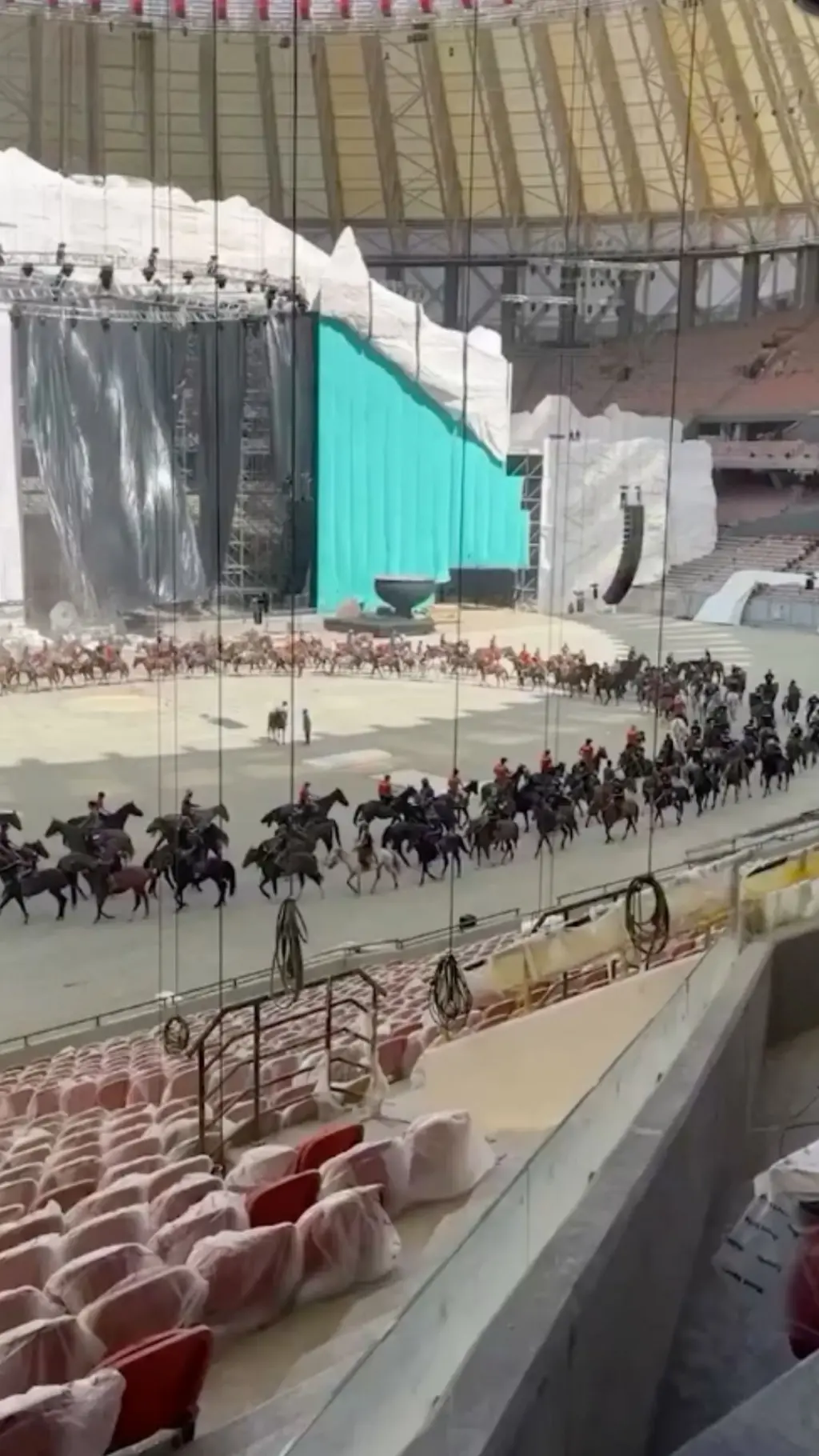 horse riders forming a circle in an arena