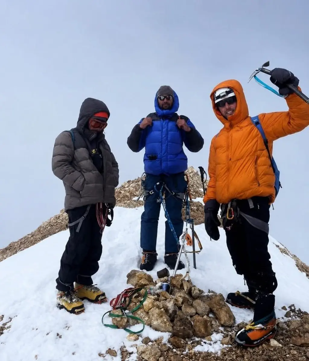 three mountain climbers