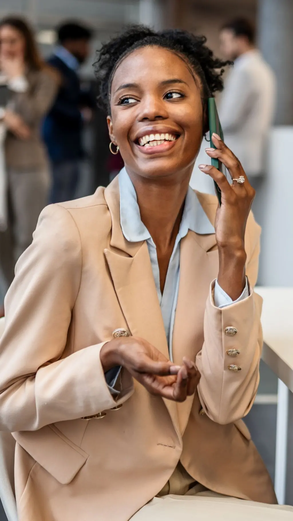 A woman in suit making call