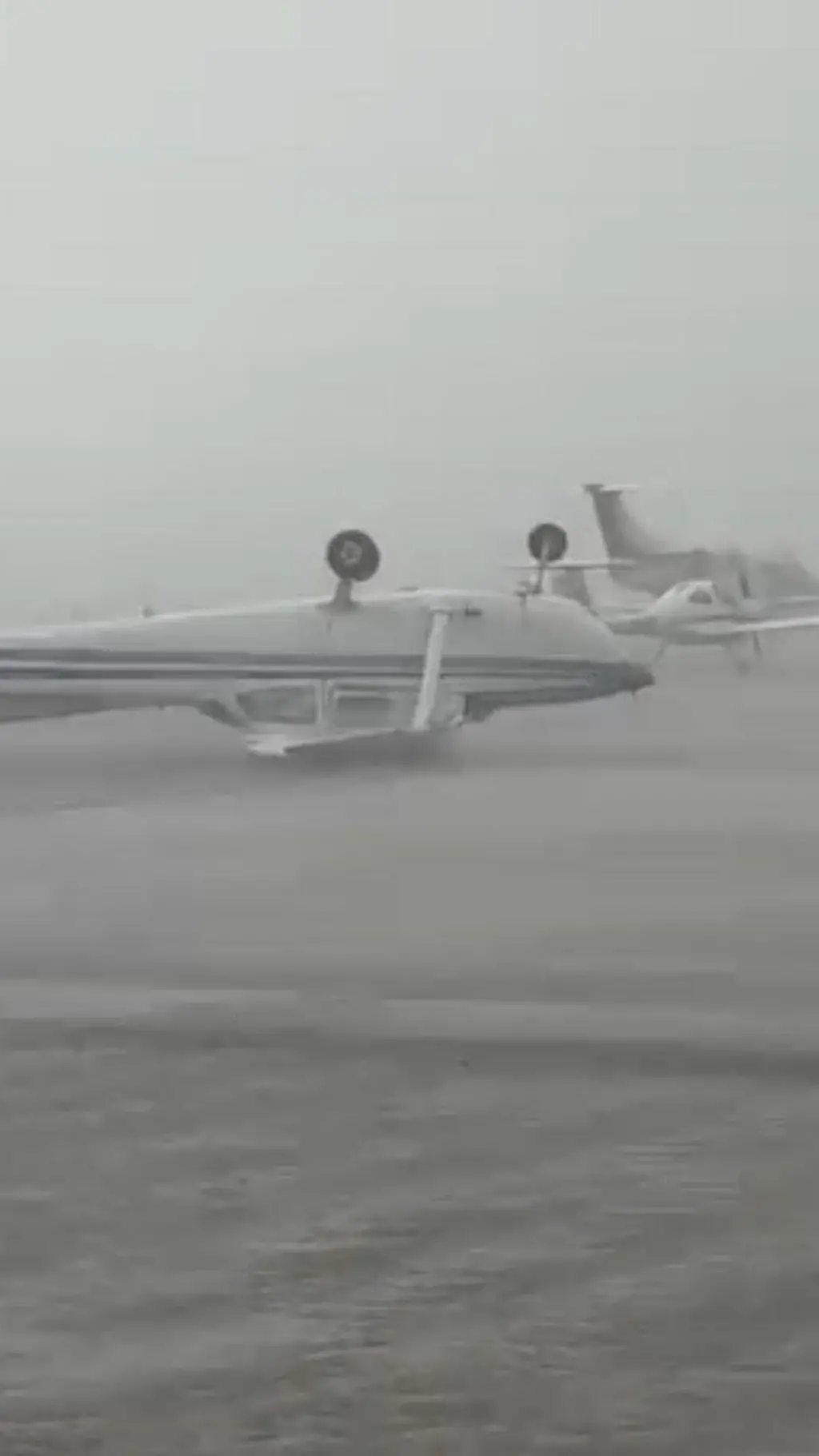 Winds flip aircraft in Italy