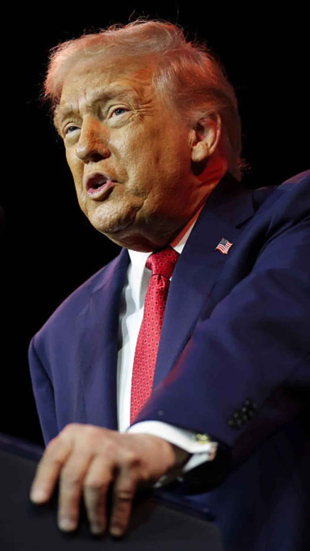Donald Trump in blue suit and red tie