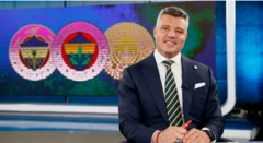 Sadettin Saran televizyonda arkada Fener logoları var. Takım elbiseli ve kameraya gülüyor