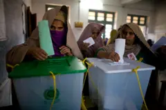 Two women cast their ballots in the parliamentary election on 18 February 2008 in Peshawar, Pakistan.