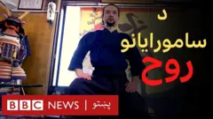 د کوشیرو میناموتو د ژوند ماموریت خلکو ته د سامورايي دود ورزدکول دي. خو کوویډ یې د توکیو اولمپیک کې سیلانیانو ته د زدکړې پلان ګډوډ کړ.