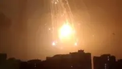 An explosion is seen in the sky over Kyiv