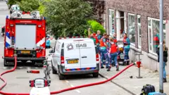 ပစ်ခတ်မှုဖြစ်ခဲ့တဲ့နေအိမ်တိုက်ခန်းရှေ့ ကမြင်ကွင်း