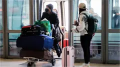 Travellers at a New Jersey airport
