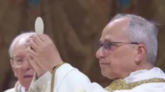 Pope Leo blesses the Eucharist 