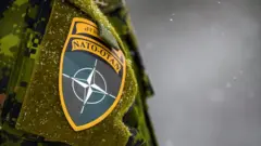 солдат НАТО на учениях в Латвии