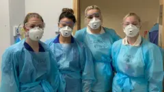 Molly, second from left, with other physios, before she got ill