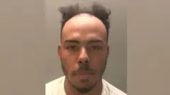 Sawirka Jermaine Taylor ee ay booliiska daabaceen