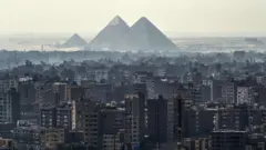 Skyline of Cairo and the pyramids of Giza