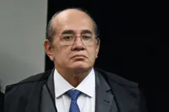 Gilmar Mendes é um homem branco,código promocional f12 betmeia idade, com óculoscódigo promocional f12 betgrau quadrados, vestindo uma camisa branca, com gravata azul sob paletó escuro.