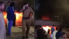 قوات الدفاع المدني تحاول إطفاء نيران في سيارة