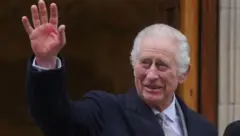 King Charles waves as he leaves hospital