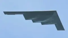A stealth bomber seen flying through the sky