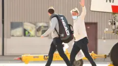 Tennis players and officials exit off QR7176 flight from Doha at Melbourne Jet Base in Melbourne, Australia