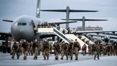 Hundreds of German troops arrive back in their home country from Afghanistan