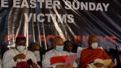 Cardinal Malcolm Ranjith (2R) attends a mass in remembrance of Easter Sunday attacks victims to mark the second anniversary of the attacks, in Colombo on April 21, 2021. - Survivors of devastating Islamist suicide bomb attacks on churches and hotels in Colombo held a private service on April 21 amidst a pandemic lockdown as the deeply scarred country paid tribute with a nationwide two minute silence.