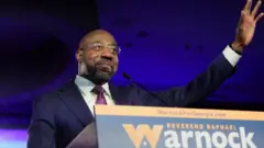 U.S. Senator Raphael Warnock (D-GA) speaks during an election night party after a projected win in the U.S. midterm runoff election