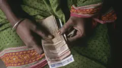 জমানো টাকায় হাত দিতে হচ্ছে মানুষের