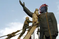 US troops enter central Baghdad and topple the statue of Saddam Hussein on 9 April, 2003