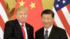 US President Donald Trump, left, and Xi Jinping, China's president, shake hands during a news conference at the Great Hall of the People in Beijing, China, on Thursday, Nov. 9, 2017