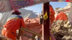 Rescuers work amid rubble in the aftermath of an earthquake in a location given as Shigatse City, Tibet Autonomous Region, China, on 7 January 2025, in this screengrab obtained from a handout video. 
